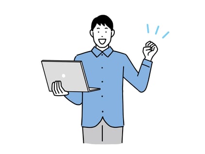 パソコンを持ってガッツポーズをする男性
