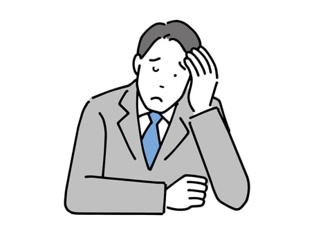 頭を抱える男性