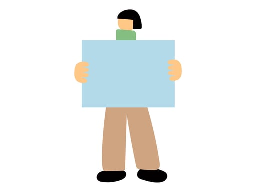 ボードを見せる人物