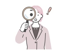 虫眼鏡を覗く女性