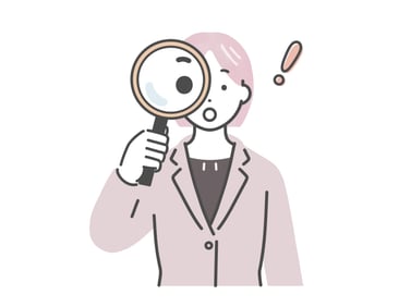 虫眼鏡を覗く女性