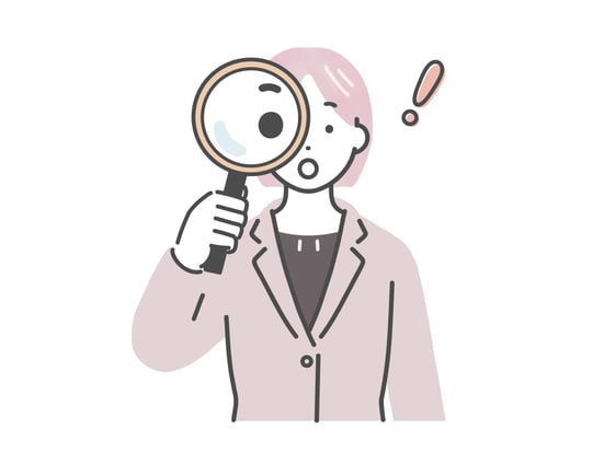 虫眼鏡を覗く女性